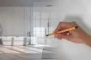 hand holding a pencil sketching a bathroom